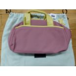 A RADLEY PINK TEXTILE HANDBAG WITH LIME LEATHER HANDLES AND EDGINGS, THE INTERIOR LINED WITH