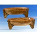 A PAIR OF FRENCH ART DECO BROWN AGATE ELONGATED OVAL BOWLS RAISED ON GILT BRONZE FEET AT EACH NARROW