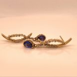 A PAIR OF 14ct YELLOW GOLD TANZANITE AND DIAMOND ARTICULATED DROP EARRINGS, GROSS WEIGHT 3.1grms.