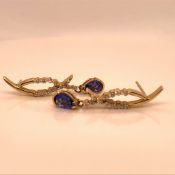 A PAIR OF 14ct YELLOW GOLD TANZANITE AND DIAMOND ARTICULATED DROP EARRINGS, GROSS WEIGHT 3.1grms.