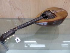 A MANDOLIN WITH ROSEWOOD BACK AND GRAPEVINE INLAID TORTOISESHELL SURROUND TO THE SOUND BOX. W 61.