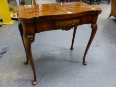 A GEORGIAN STYLE WALNUT FOLD OVER TEA TABLE WITH SHAPED TOP, SMALL FRIEZE DRAWER ON LONG SLENDER