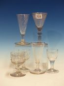 AN 18th C. EUROPEAN SODA GLASS WINE, THE FLOWER ENGRAVED CONICAL BOWL ON KNOPPED AND TEARED STEM