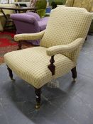 A BESPOKE VICTORIAN STYLE ARMCHAIR WITH TURNED ARM SUPPORTS AND FORELEGS, BRASS CASTERS, POSSIBLY BY