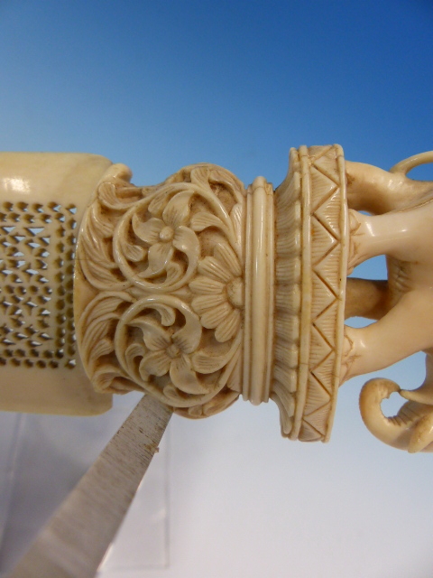 AN INDIAN IVORY PAGE TURNER, THE PIERCED SCIMITAR SHAPE BLADE ATTACHED TO A HANDLE CARVED WITH AN - Image 5 of 13