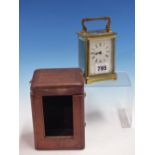 A LEATHER CASED CARRIAGE TIMEPIECE, THE GLAZED BRASS CASE. H 11.5cms.