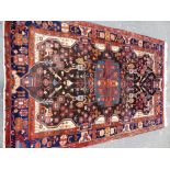 A PERSIAN TRIBAL RUG 275 x 170cms.