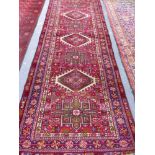 A PERSIAN KARADJA RUNNER 264 x 102cms.