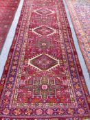 A PERSIAN KARADJA RUNNER 264 x 102cms.