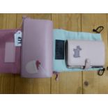 A RADLEY PINK LEATHER FILOFAX AND PEN, A PINK LEATHER WALLET AND CARD CASE TOGETHER WITH THEIR COVER