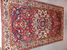 A PERSIAN BAKHTIARI RUG 200 x 165cms.