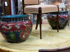 A PAIR OF JAPANESE CLOISONNE PLANTERS, THE RED BANDS ON THE SHOULDERS WITH BUTTERFLIES, MYTHICAL