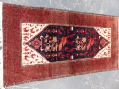 A TRIBAL BELOUCH RUG 195 x 104cms.