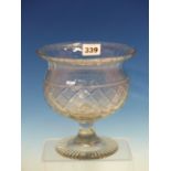 A FOOTED THISTLE SHAPED CLEAR GLASS BOWL, THE BODY WITH STRAWBERRY CUT DIAMOND DIAPER BAND ABOVE