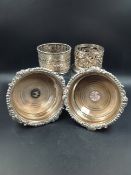 A PAIR OF SILVER PLATE FLARED COASTERS TOGETHER WITH TWO FURTHER OPEN WORK PLATED COASTERS.