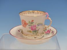 A BERLIN TREMBLEUSE COFFEE CUP AND SAUCER PAINTED WITH SPRIGS AND SPRAYS OF FLOWERS WITHIN GILT
