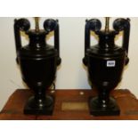 A PAIR OF EBONISED TABLE LAMPS IN THE FORM OF CLASSICAL GREEK URNS. H.45cms. (2)