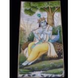 A VELVET CASED INDIAN MINIATURE OF KRISHNA SEATED BELOW A TREE BY A PEACOCK AND PLAYING A FLUTE. H