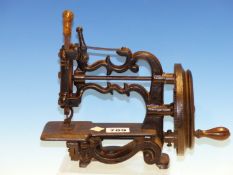 A 19th.C.CAST IRON FRAMED MINIATURE SEWING MACHINE, UNSIGNED BUT POSSIBLY THE GLOBE BY JAMES WEIR,