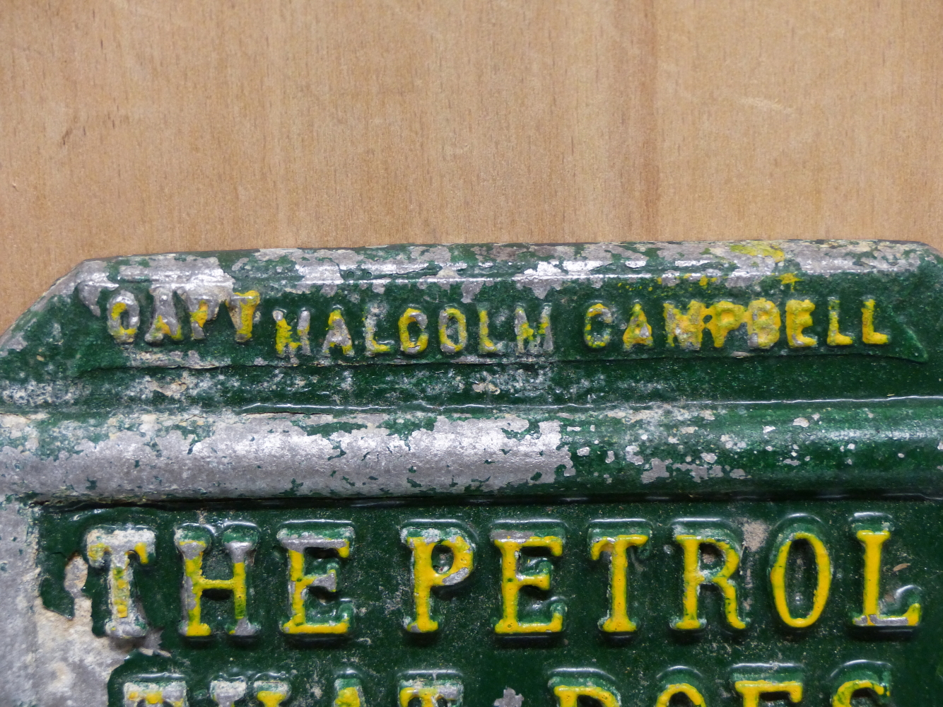 A GREEN AND YELLOW PAINTED HEXAGONAL ALUMINIUM BP ADVERTISING PLAQUE, THE PETROL THAT DOES 3 MILES A - Image 3 of 7