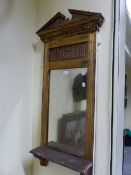 AN EDWARDIAN GILT FRAMED HALL MIRROR WITH SHELF. 48 x 106cms.