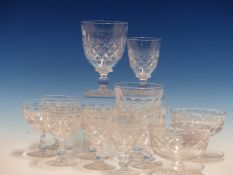 A TUDOR CLEAR GLASS DRINKING SET, EACH PIECE CUT WITH A BAND OF ROUNDELS ABOVE DIAMOND DIAPER AND