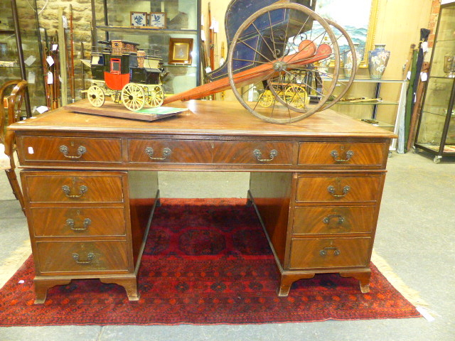 AN ANTIQUE MAHOGANY TWIN PEDESTAL PARTNER'S DESK WITH TOOLED LEATHER TOP. 153 x 106cms.
