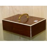 AN ART DECO WALNUT AND IVORY TWIN LIDDED CIGAR BOX IN THE MANNER OF ASPREYS. 29 x 21cms.