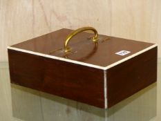 AN ART DECO WALNUT AND IVORY TWIN LIDDED CIGAR BOX IN THE MANNER OF ASPREYS. 29 x 21cms.