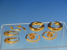 TWO PAIRS OF 9ct GOLD HOOP EARRINGS TOGETHER WITH A PAIR OF 9ct GOLD FOLIATE ENGRAVED CREOLE
