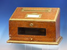 AN ASPREY BRASS MOUNTED OAK COUNTRY HOUSE LETTER BOX, THE BEVELLED GLASS FRONT ABOVE A SHALLOW