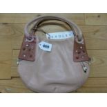 A RADLEY PALE TERRACOTTA LEATHER HANDBAG, THE DARKER CORNERS APPLIED TO ONE SIDE SEWN WITH BEADED