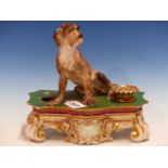 A JACOB PETTIT INKSTAND SURMOUNTED BY A DOGUE DE BORDEAUX SEATED ON THE GILT GREEN TOP WITH A