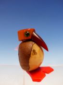 A DUNHILL TASTE BIRD WITH FATURIN BEAK, THE NUT BODY CARVED WITH CARD SUITS ABOVE THE RED PLASTIC