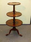 A MAHOGANY DUMB WAITER, THE THREE DISHED TIERS ON TRIPOD WITH LONG NOSE CLUB FEET. H 113cms