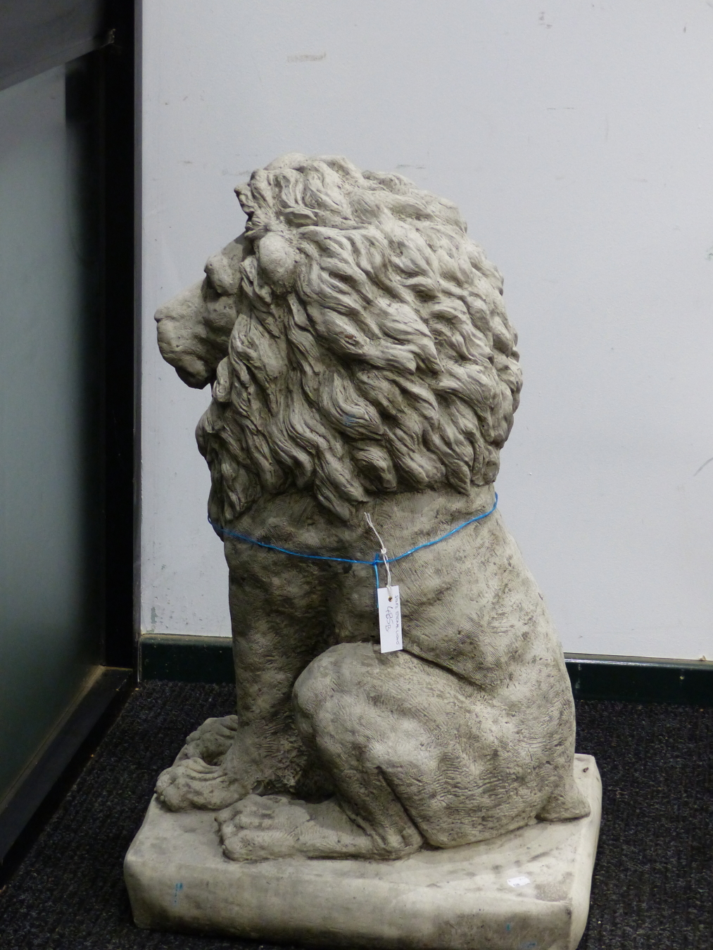 A PAIR OF COMPOSITION STONE LIONS SEATED ON RECTANGULAR BASES. H 89cms. - Image 4 of 5