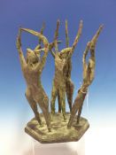 A BRONZE PATINATED COMPOSITION GROUP OF FIVE FIGURES WITH HANDS RAISED AS THEY DANCE ON A