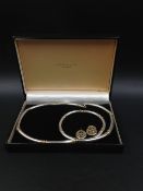 A SILVER AND GOLD GEOFFREY TURK LTD SUITE CONSISTING OF A MATCHING NECKLACE, BRACELET AND A PAIR