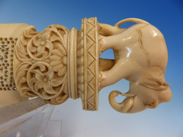 AN INDIAN IVORY PAGE TURNER, THE PIERCED SCIMITAR SHAPE BLADE ATTACHED TO A HANDLE CARVED WITH AN - Image 3 of 13