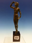 AFTER THE ANTIQUE, A BRONZE NUDE FEMALE HOLDING A LEAF IN ONE HAND AND SHIELDING HER EYES TO LOOK