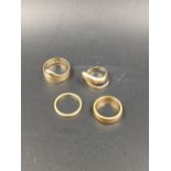 TWO 22ct WEDDING BANDS, A 750 STAMPED COILED SERPENT RING AND A FURTHER VICTORIAN 18ct HALLMARKED