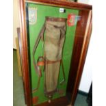 A VINTAGE GOLFING DISPLAY OF EARLY 20th.C.BAG & CLUBS, CRESTED CLUB SHIELD AND A TROPHY IN A
