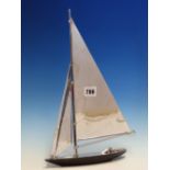 A PARKER YACHT LIGHTER WITH TWO CHROME PLATED JIB SAILS AND THE MAIN SAIL OVER THE LIGHTER ROD,