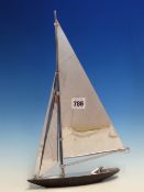 A PARKER YACHT LIGHTER WITH TWO CHROME PLATED JIB SAILS AND THE MAIN SAIL OVER THE LIGHTER ROD,