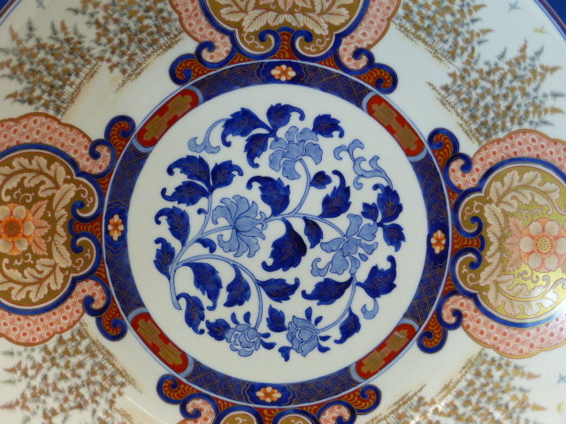 A FUKUGAWA IMARI DISH, THE RUYI FRAMED FLORAL LAPPETS ALTERNATING WITH STANDS OF BAMBOO AND - Image 3 of 18