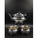 A SILVER HALLMARKED THREE PART TEA SET, DATED 1930 FOR HARRISON BROTHERS & HOWSON (GEORGE HOWSON)