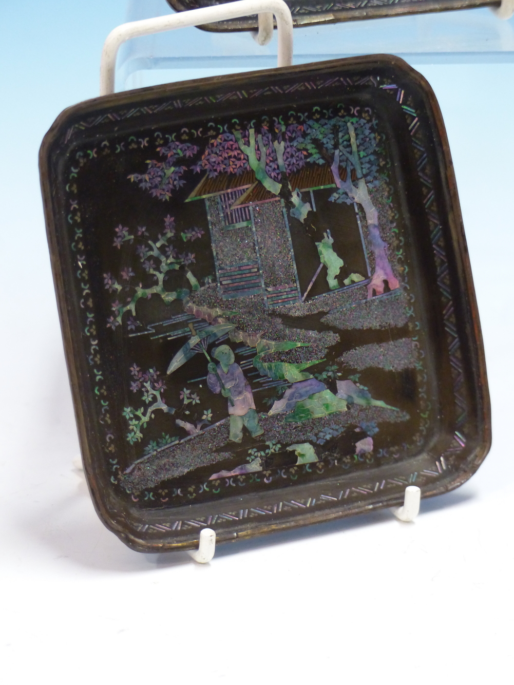 A PAIR OF LAC BURGAUTE SQUARE TRAYS, THE METAL MOUNTED RINGS ENCLOSING MOTHER OF PEARL FIGURES IN - Image 2 of 14