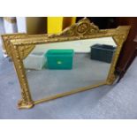 AN ANTIQUE GILT GESSO FRAMED OVERMANTLE MIRROR. 160 x 80cms.