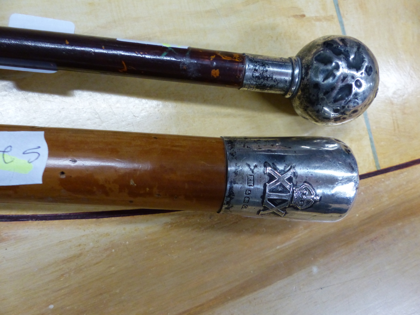 A SILVER MOUNTED SWAGGER STICK, BIRMINGHAM 1931 WITH A CROWN OVER XIX IN RELIEF, POSSIBLY FOR THE
