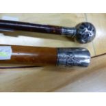 A SILVER MOUNTED SWAGGER STICK, BIRMINGHAM 1931 WITH A CROWN OVER XIX IN RELIEF, POSSIBLY FOR THE